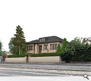 An open plan living area and entrance hall occupies the ground floor