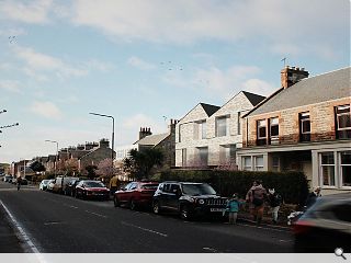 Crinkled roof permits net-zero Gullane apartments to see the light