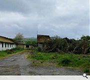 Surviving hospital buildings stand in a poor state of repair