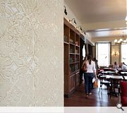 Vintage wallpaper provides a backdrop to coffee supping