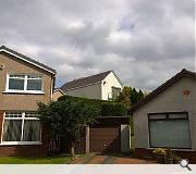 The overscaled property towers over neighbouring bungalows