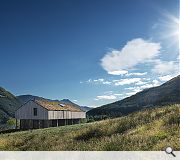 A green roof helps blend the lodge into the mountainside