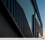 Metal panels and reglit cladding maintain an industrial aesthetic