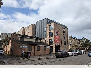 Street hugging infill housing rises in Partick 