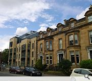 A top floor is set back to marry with adjacent terraced housing