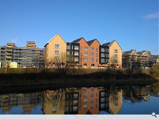 ‘Industrial’ canalside homes take shape