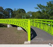 The lime green crossing replaces an earlier bridge dating from 1893, deemed to have reached the end of its lifespan