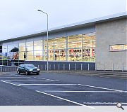 A stone facade attempts to blend the store into its surroundings