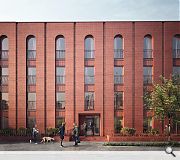 A consistent palette of red brick extends the civic treatment of the Ibrox main stand