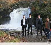 The winning teams pose at the Falls of Falloch beauty spot