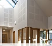 A bright atrium leads onto communal living areas