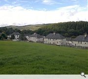 The existing site is elevated above the village