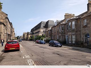Double mansard roof to extend a New Town office block 