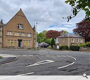 The existing church and manse seen from High Cross Avenue