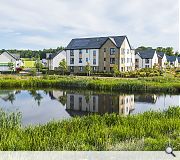 Homes are arrayed around landscape features features