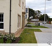 Public realm around the new housing integrates with surrounding parkland