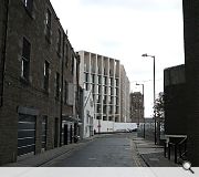 A contemporary new build facade denotes the complex's rear elevation