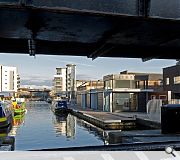 Contrasting facade treatment sees a solid facade presented to the road with an open glazed facade presenting to the Union Canal