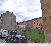 The vacant site is currently in use as a community garden