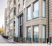 Parking bays have been sunk below a landscaped garden to the rear of the site