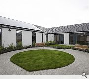 Patient rooms overlook a secluded landscaped courtyard