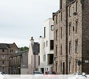 This modest housing development unlocks the potential of an old builder’s yard, successfully fitting into the tight and eclectic urban grain of Edinburgh’s Southside.