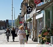 Main streets on the town centre grid benefit from high quality paving and street furniture