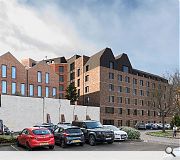 Mixed brick and concrete detailing acknowledge the site's history