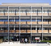 Warm red cedar cladding contrasts with the prevailing grey Aberdeenshire granite