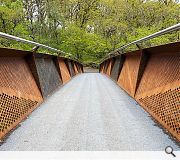 Perforated steel lends transparency to the bridge 