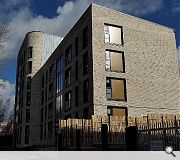 A curved frontage responds to an adjacent tenement