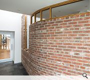 An engraved brick wall harks back to the lost tradition of brick construction on the island