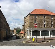 The existing clay-tile roof and shopfront will be demolished