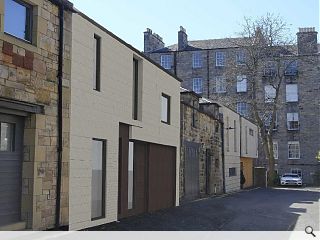 Low carbon mews to complete a New Town street