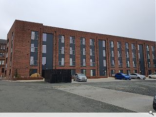 Twin apartment blocks complete school's residential rebirth