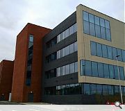 An industrial brick rear elevation contrasts with a Fibre C clad front facade