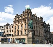 Cartouches on each elevation depict the cities they face; Glasgow, Stirling and London