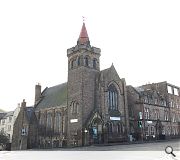 The nave window will be cut down to street level to flood the gloomy interior with light