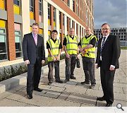 Dawn's Paul O'Donnell poses alongside Glasgow City Council leader Gordon Mathieson and three apprentices